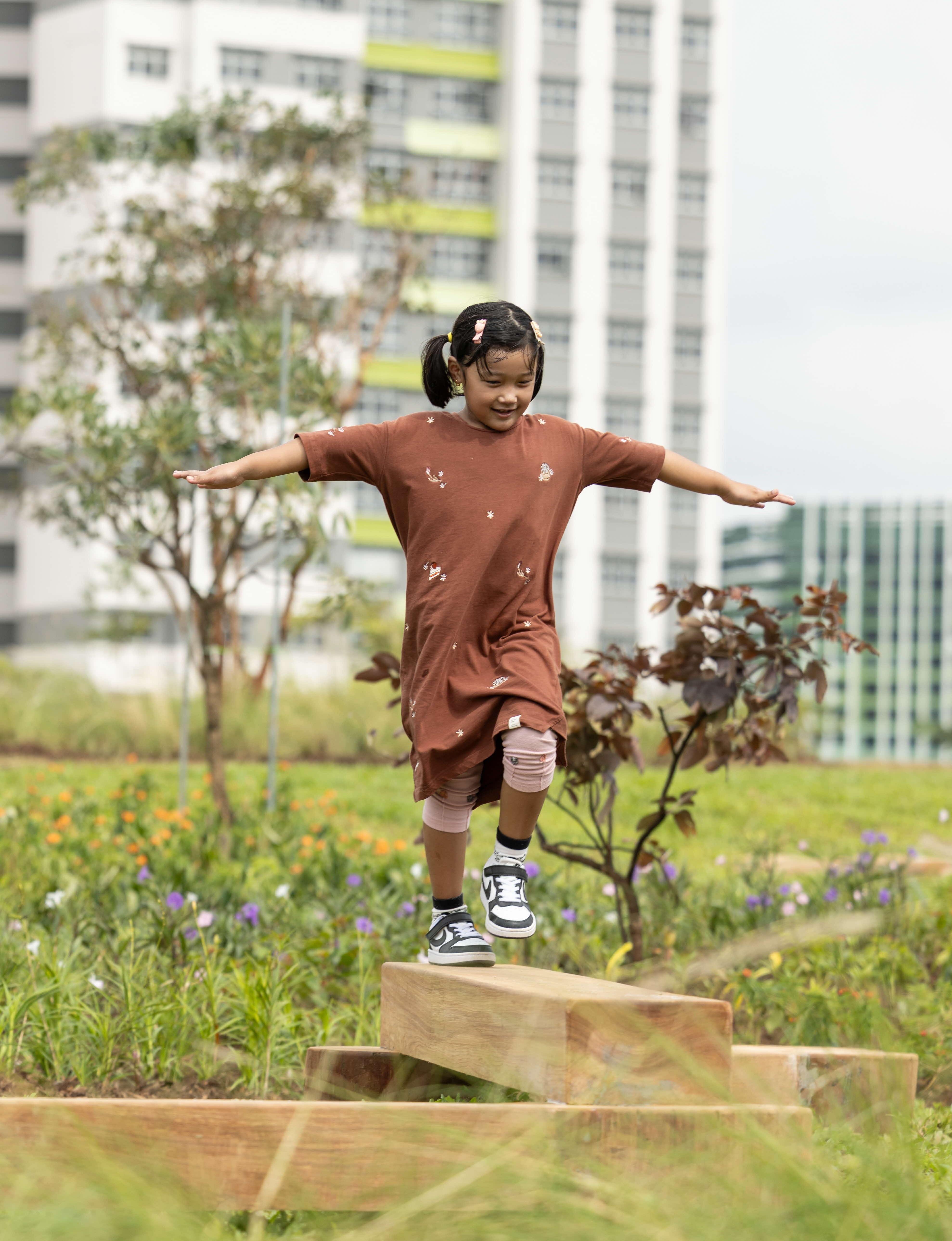 Girl playing at a playgarden